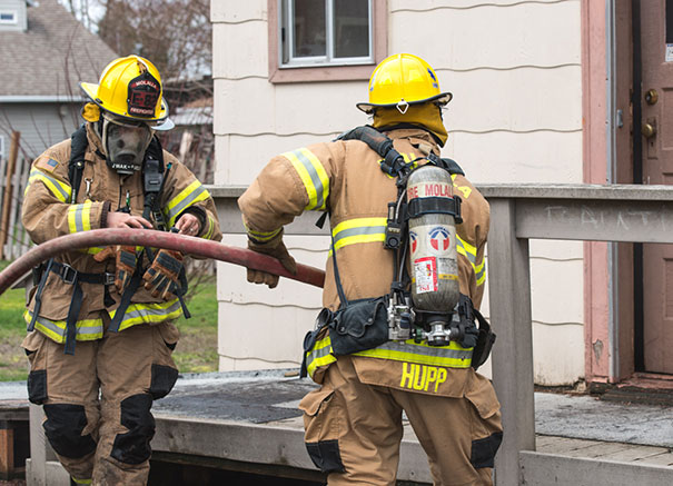 Firefighters entering building